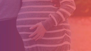 Healthy Beginnings: Woman holding her pregnant belly
